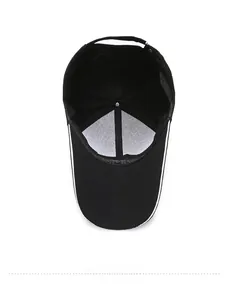 Detail view of the black canvas baseball cap interior with white lining and stitching