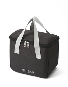 Detail of waterproof insulated black lunch bag with grey handle and double zipper