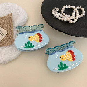 Light blue translucent fish tank hair claw clips with goldfish and seaweed patterns