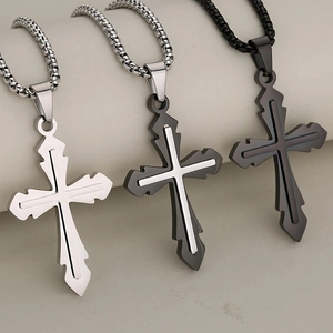 Three minimalist stainless steel cross necklaces in silver, black, and two-tone finishes