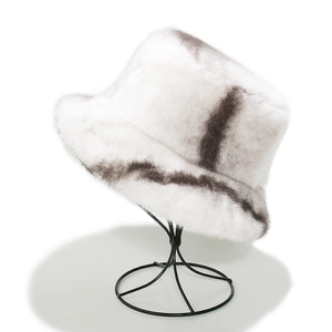 Detailed view of the thick faux fur texture and grey-white patterns on the bucket hat