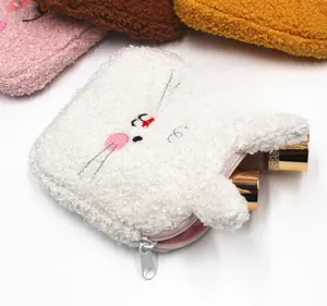 Detail of plush lamb wool sanitary pad pouch showing zipper closure and cute rabbit design
