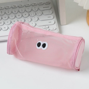 Detailed macro of pink mesh pencil case with cute googly eyes and smooth zipper