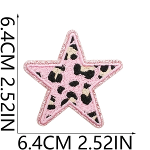 Detail of pink leopard print star patch with glitter borders measuring 6.4cm