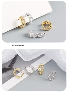 Detail of S925 sterling silver chain earrings featuring cubic zirconia in gold and silver