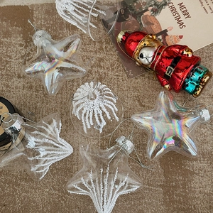 Christmas star and bell hanging ornaments with astronaut theme on brown textured fabric