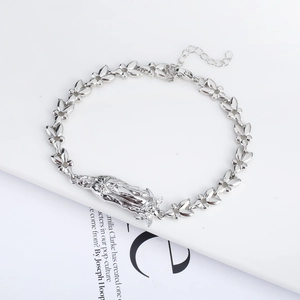 Adjustable silver floral link bracelet featuring a classic Virgin Mary religious pendant