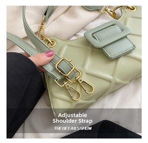 Detail of adjustable straps with gold buckles on light green quilted handbag