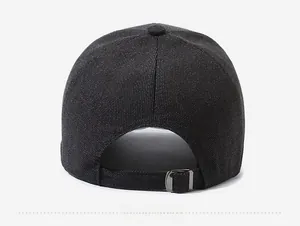 Detail view of adjustable metal buckle and textured fabric on the back of gray baseball cap