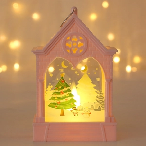 Pink Christmas LED lantern detail showing layered paper-cut snowmen and warm lights