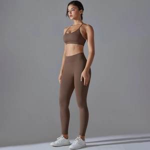 Detail of dark brown seamless yoga set with V-waist leggings and cross-back sports bra