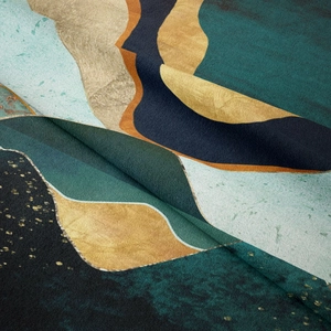 Close-up of soft velvet fabric with abstract mountain patterns and gold foil details