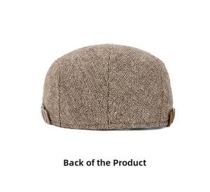 Rear view of brown herringbone newsboy hat with adjustable metal side buckles details