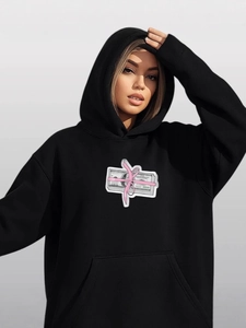 Oversized black hoodie with dollar bill and pink ribbon print in streetwear style