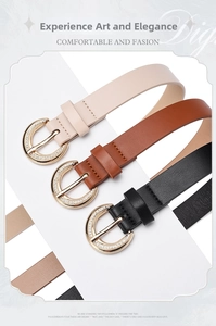 Close-up of thin leather belts with gold rhinestone buckles in beige, brown and black