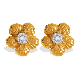Elegant gold flower stud earrings with central white rhinestone on white background