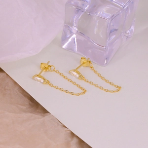 Elegant S925 sterling silver rhombic diamond earrings with gold tassels on ice