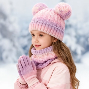Detailed knit texture of pink purple gradient winter set with faux fur pom-poms