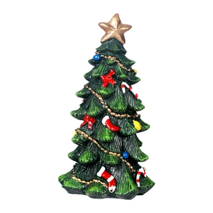 Miniature green Christmas tree figurine with gold star and festive ornaments on white background