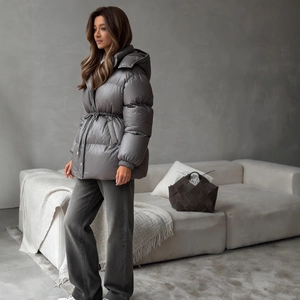 Women's grey hooded padded jacket with adjustable drawstring waist and side profile view
