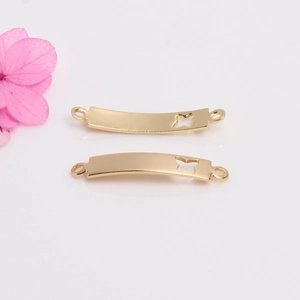 Detailed view of 14k gold-filled curved bar connectors with hollow butterfly design