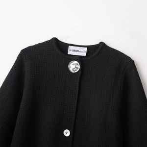 Black knit cardigan for women with textured fabric and decorative silver buttons