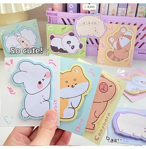 Close-up of cute cartoon animal sticky notes including rabbit and panda for journaling