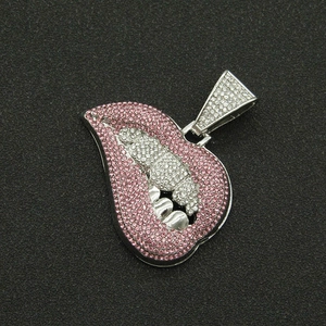 Close-up of hip hop pendant featuring pink and silver rhinestones in a lip shape