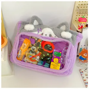 Detail of cute purple plush cat shoulder bag featuring a clear window for small toys