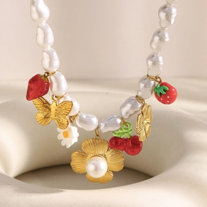 Baroque pearl necklace with 18K gold butterfly, flowers and red strawberry charms