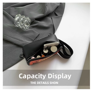 Top view of compact crossbody bag interior showing storage for phone and cosmetics