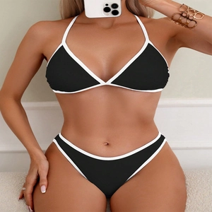 Sexy black halter bikini set with white piping trim and low waist bottoms for beach wear