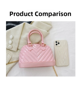 Detailed shot of pink jelly shell bag with chevron pattern and gold chain strap