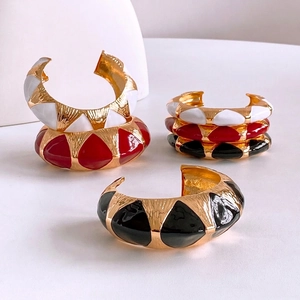 Vintage oval black and gold enamel open bangle with geometric pattern for women