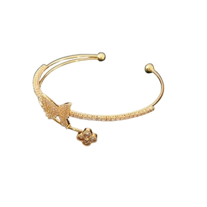 Double-layered gold cuff bracelet with cubic zirconia butterfly and flower accents