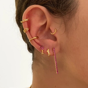 Detail of s925 silver gold hoop earrings set with pink gems and long dangle ear cuffs