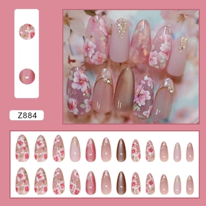 Pink cat eye press-on nails with cherry blossom art, pearls and glitter sequins