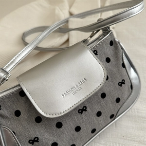 Silver metallic leather crossbody bag with black polka dots and gray bow pattern