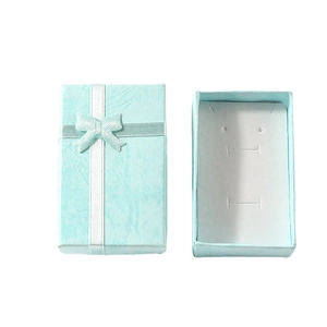 Light blue jewelry gift box with ribbon bow showing closed and open views with foam insert