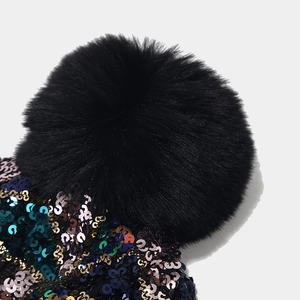 Women colorful sequin knit hat with a large faux fur pompom for winter outdoor warmth