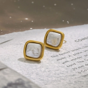 Elegant 18K gold plated stainless steel square pearl earrings shown on a vintage backdrop