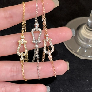 Elegant horseshoe buckle cubic zirconia bracelets in gold silver and rose gold tones