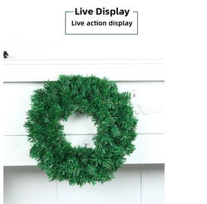Close-up of a lush green PVC Christmas wreath showing dense pine needles for decor