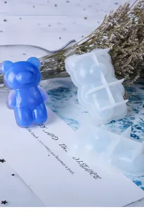 Detailed bear-shaped silicone mold for DIY resin jewelry making with a blue sample