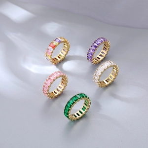 Elegant gold rings with colorful rectangular gemstones in a minimalist semi-circular layout