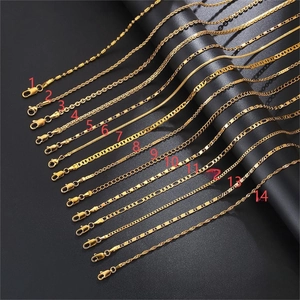 Multiple styles of 14K gold plated stainless steel flat link chains on black background