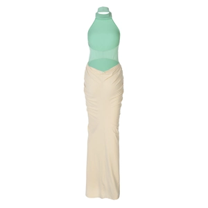 Detail of mint green halter top and beige waist cutout on a slim fit maxi dress