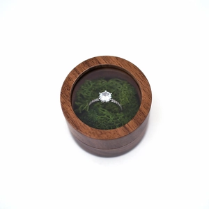 Round walnut wood ring box with glass window and green moss, minimalist jewelry storage