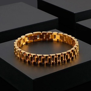Detail showing 316L stainless steel engraving on golden watch-link bracelet