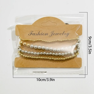 Close-up of four-piece beaded bracelet set in gold and silver with size dimensions